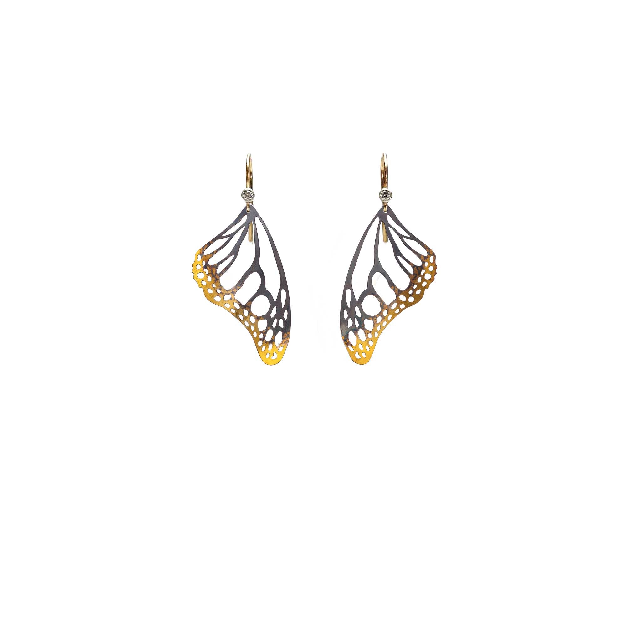 Butterfly wing mixed metal keum-boo black and gold dangle earrings with 14k and diamond ear wires on a white background