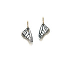 Handmade small Monarch butterfly drop earrings in oxidized silver with 14k gold ear wires over a white background