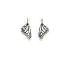 Handmade small Monarch butterfly drop earrings in oxidized silver with 14k gold and diamond ear wires over a white background | Camille Torres Designs