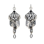 Pair of black and silver Overwinter monarch chandelier duster earrings on a white background.
