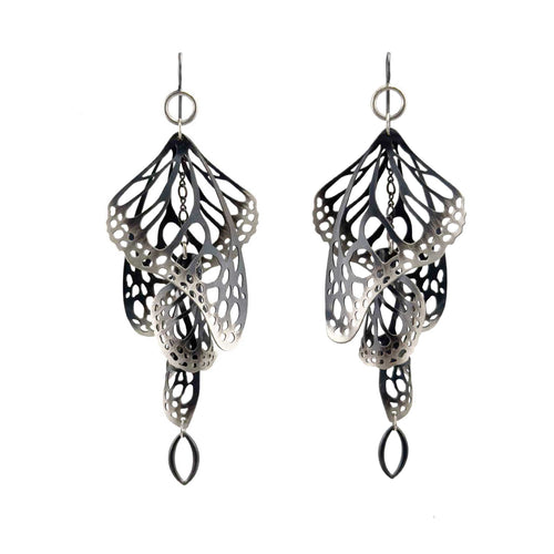 Overwinter chandelier monarch butterfly earrings in oxidized sterling silver on a white background | Camille Torres Designs