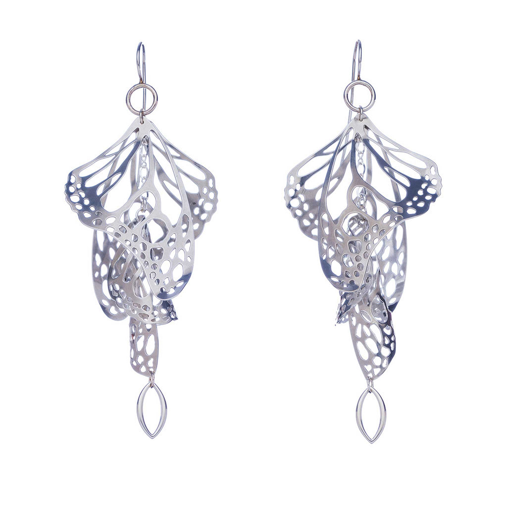 Pair of silver Overwinter monarch chandelier duster earrings on a white background.