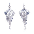 Pair of silver Overwinter monarch chandelier duster earrings on a white background.