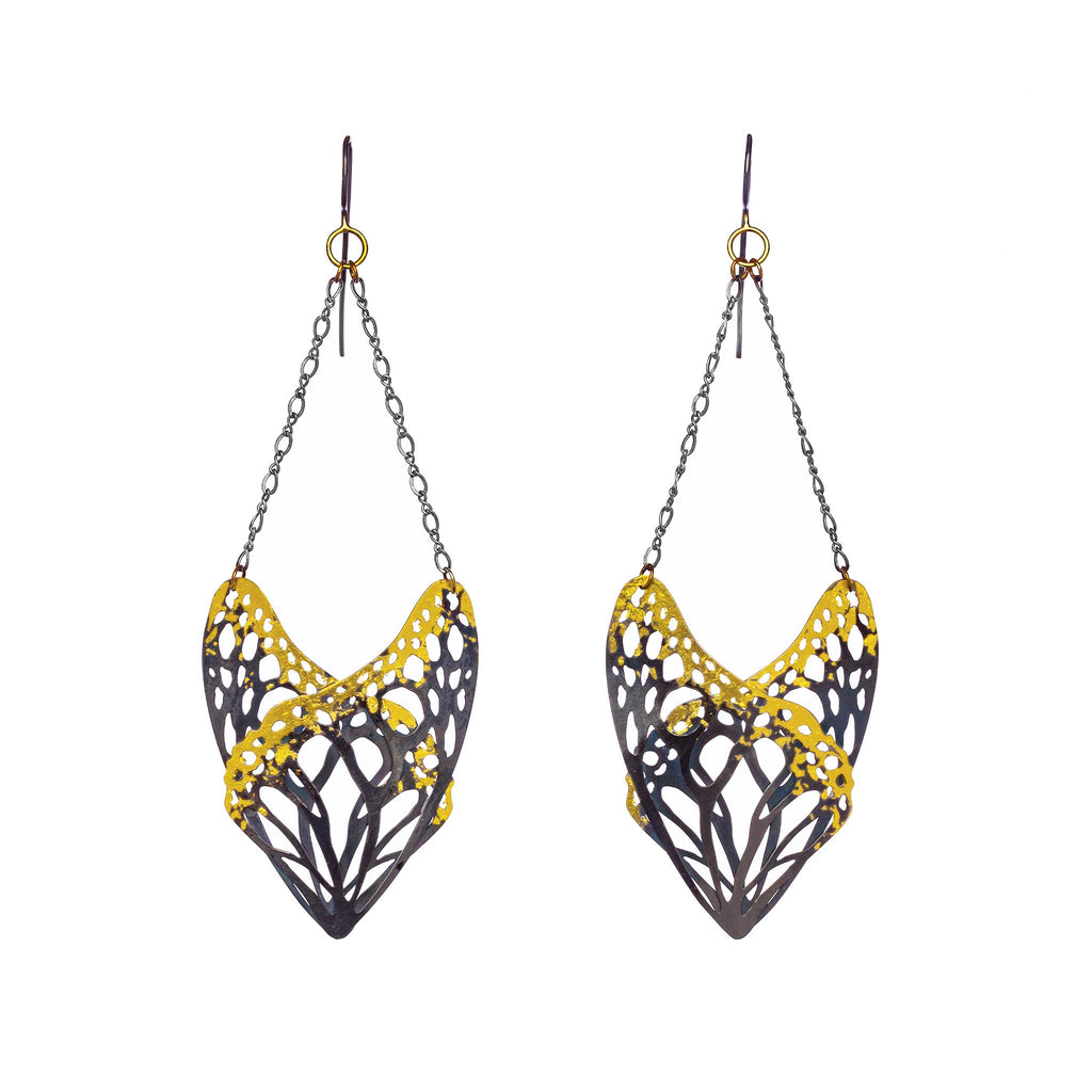 Pair of Slumber abstract butterfly dangle earrings with 24k gold and silver on white background