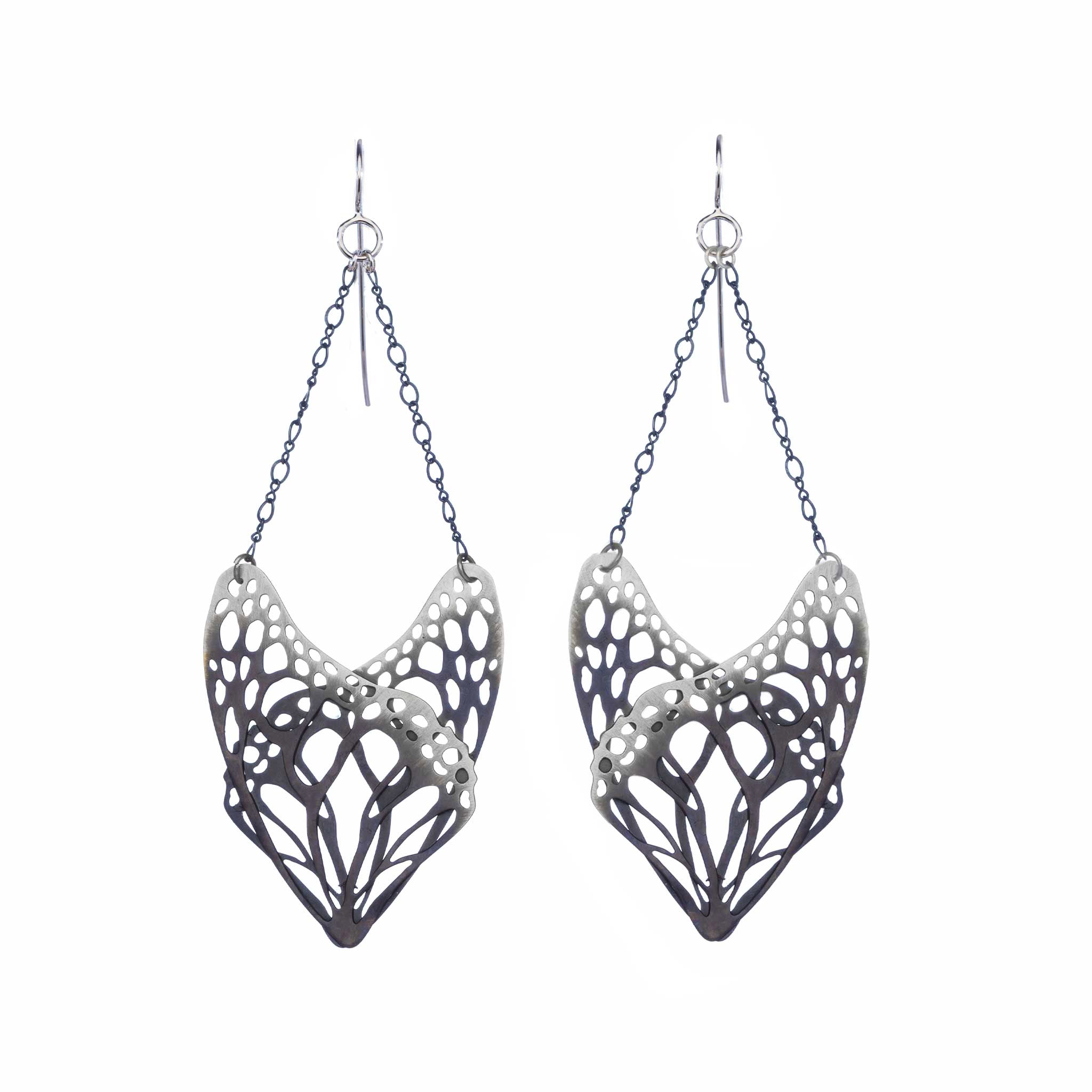 Pair of Slumber oxidized silver monarch wing earrings on a white background