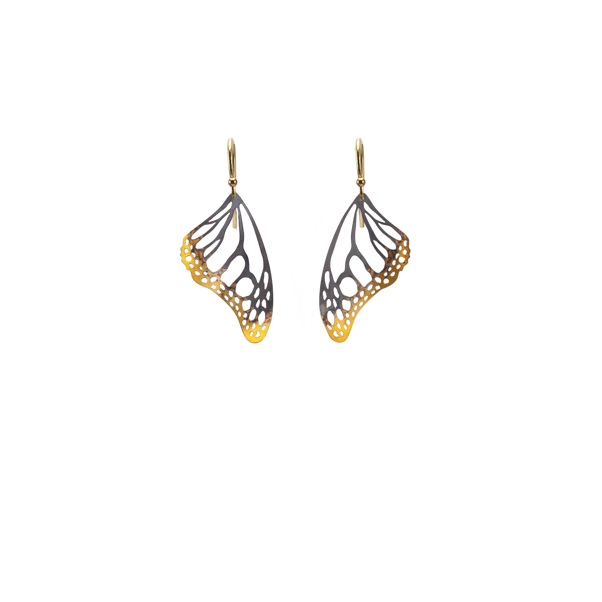 Butterfly wing mixed metal black and gold dangle earrings with 14k ear wires on a white background
