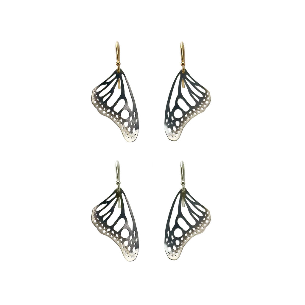 Two pair of Monarch butterfly-wing shaped earrings with silver and gold ear wires on a white background