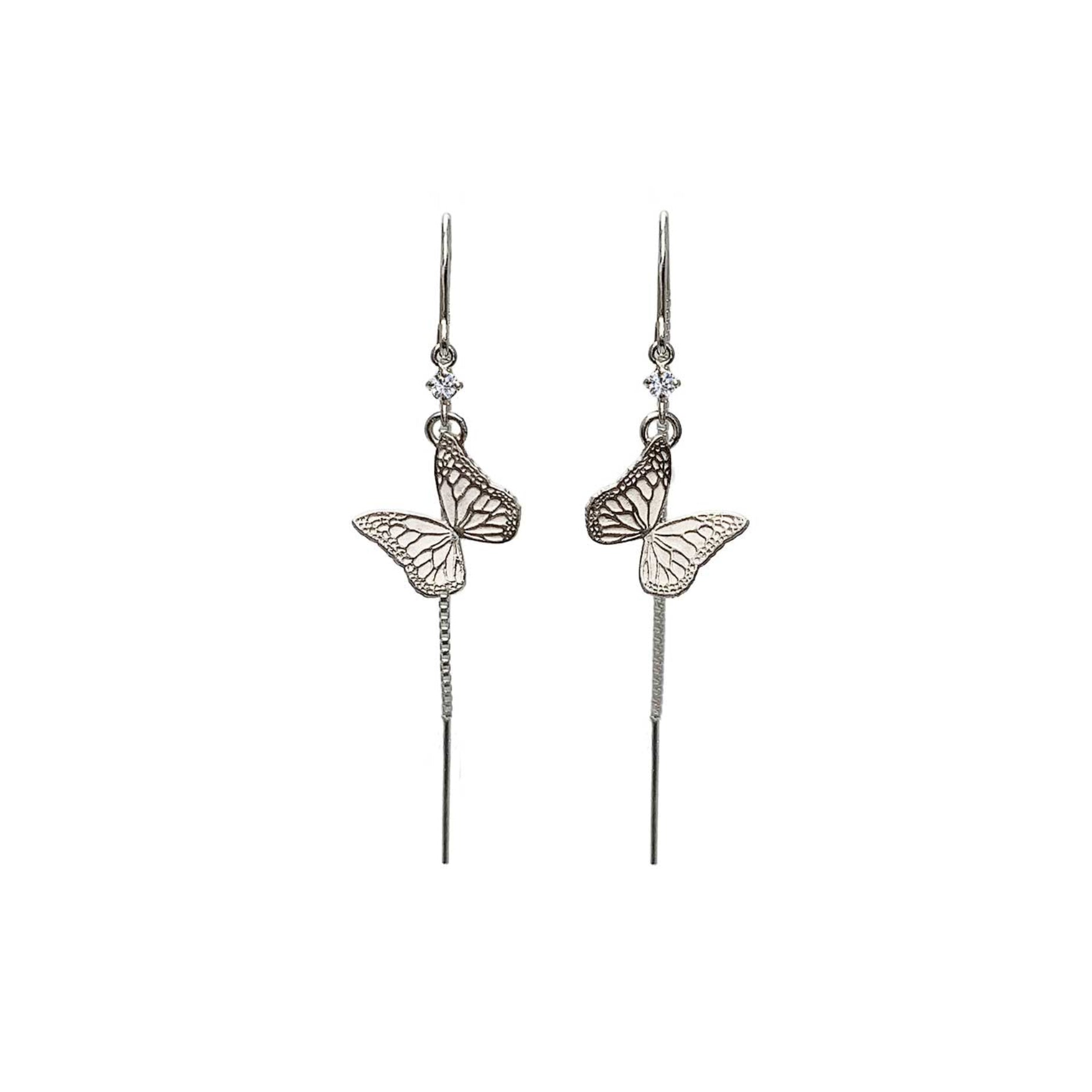 Whisper butterfly silver threader earrings against a white background