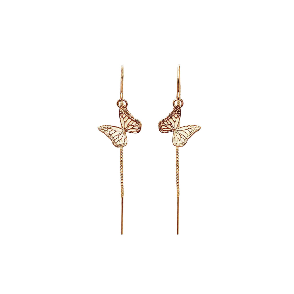Gold monarch butterfly threader earrings on a white background