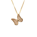 Whisper gold butterfly pendant necklace on a white background
