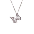 Silver butterfly charm on a chain against a white background | Camille Torres Designs