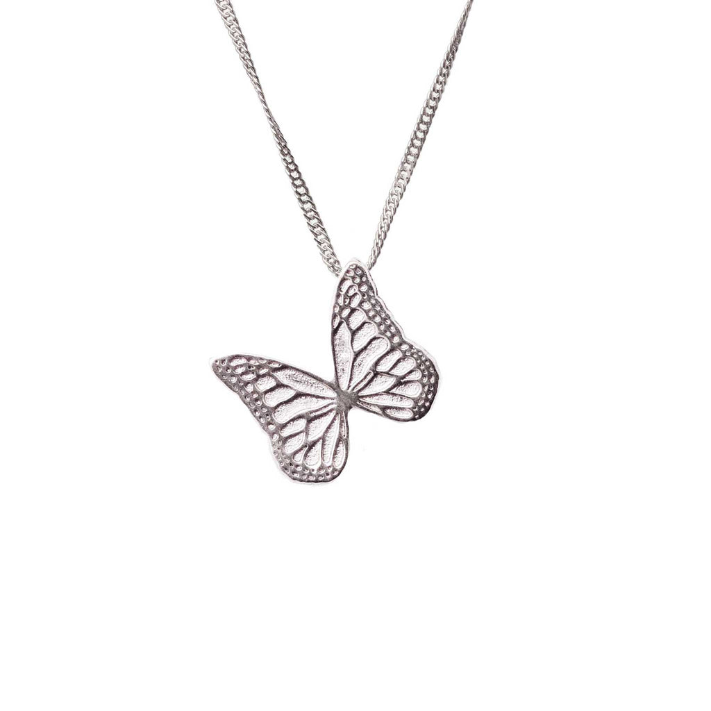 Whisper silver butterfly-shaped pendant on a chain against a white background