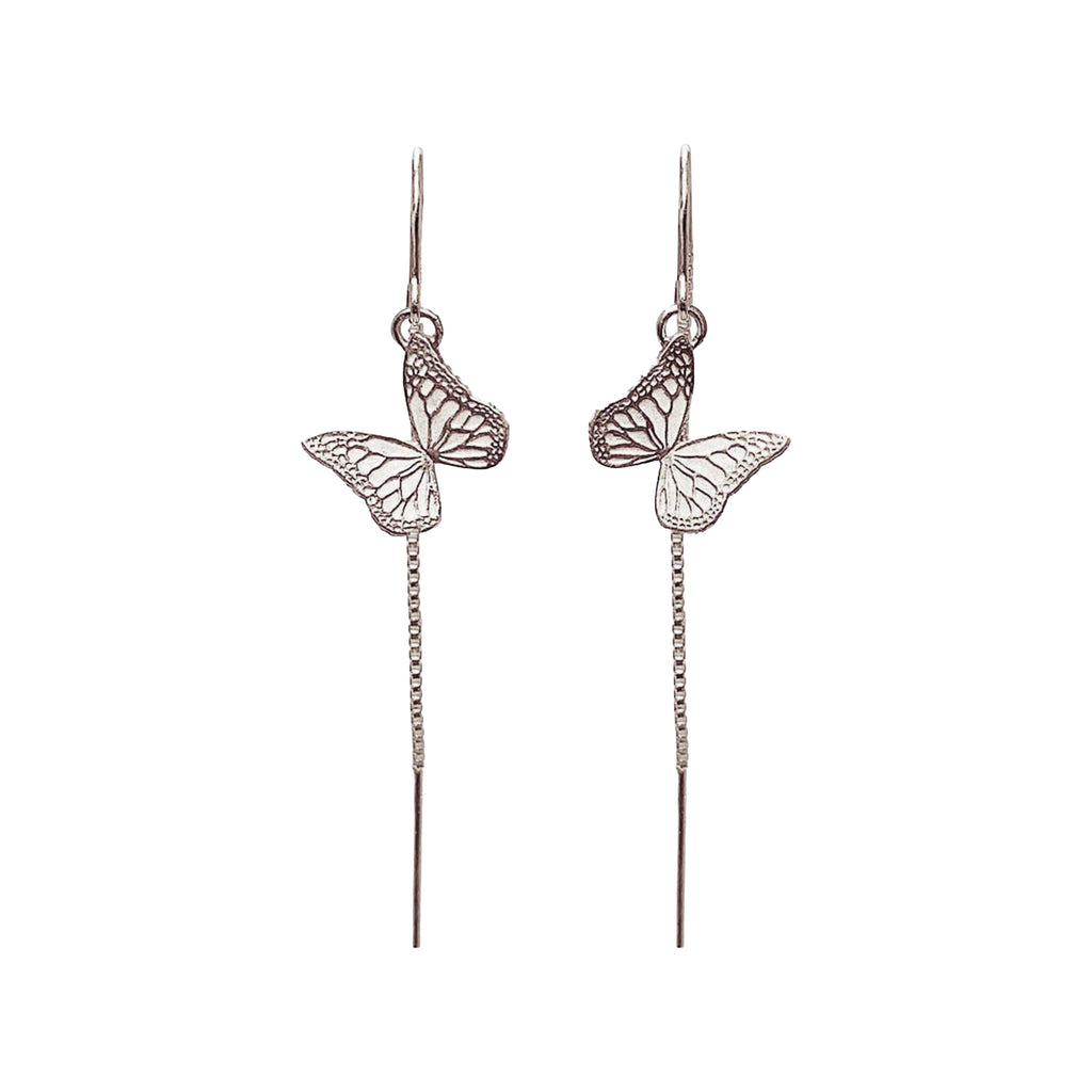 Handmade sterling silver butterfly  earrings against a white background | Camille Torres Designs