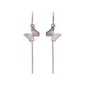Handmade sterling silver butterfly  earrings against a white background | Camille Torres Designs