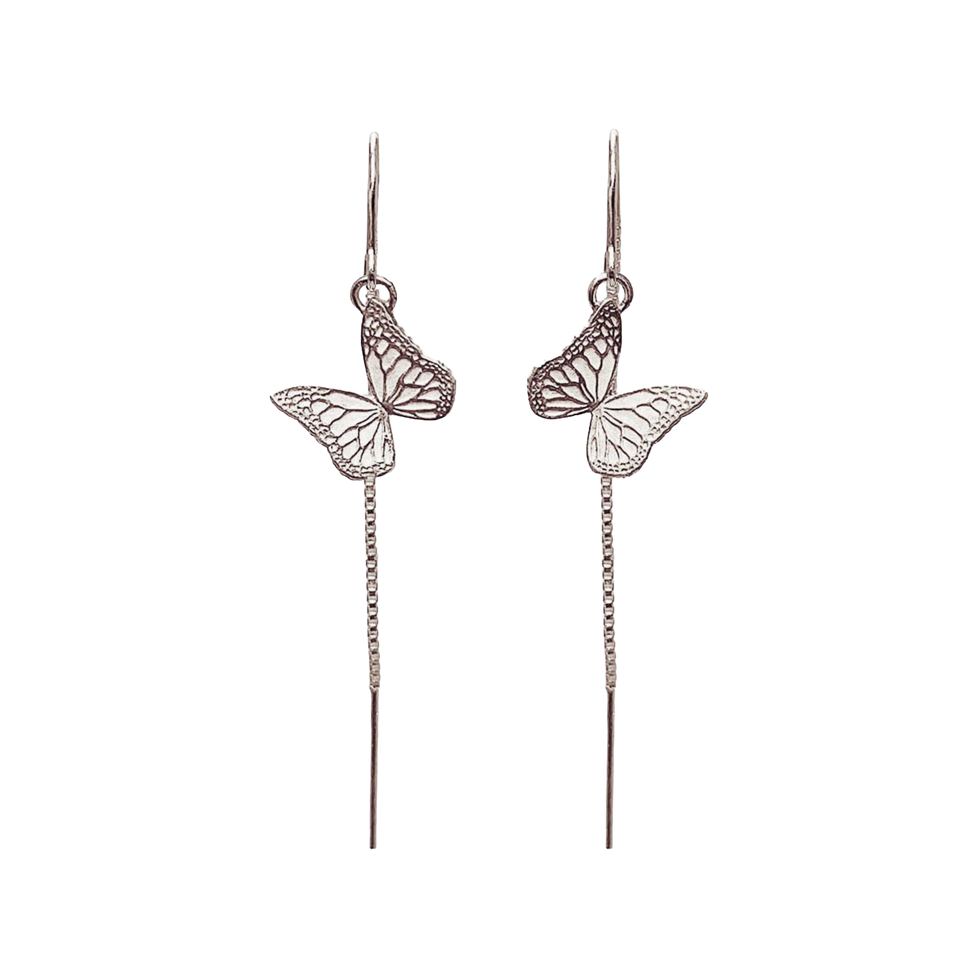 Handmade sterling silver butterfly  earrings against a white background | Camille Torres Designs