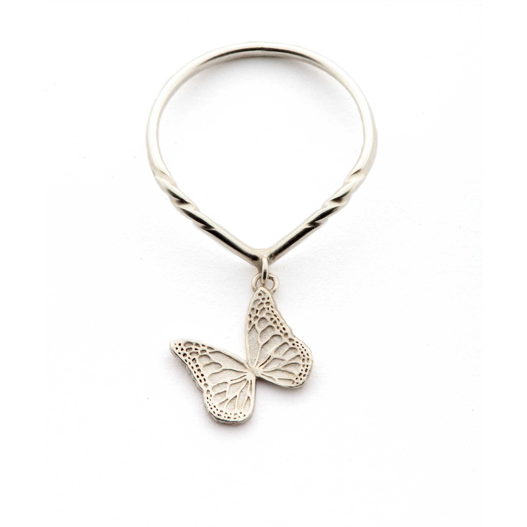 Silver Whisper charm ring with a butterfly pendant on a white background